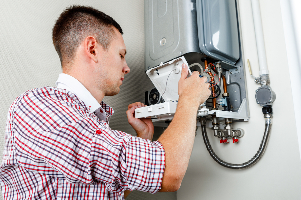 A Plumber Repairing Water Heater